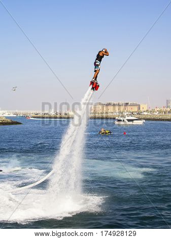 Extreme sportsman on flayborde climbs to perform tricks in the competitions in extreme sports in Dubai