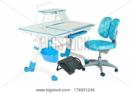 Blue chair school table blue basket desk lamp and black support under legs on the white isolated background.
