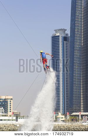 Extreme sportsman on flayborde climbs to perform tricks in the competitions in extreme sports in Dubai