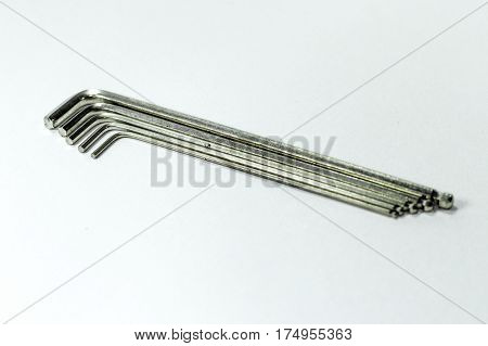Hex key Set on white background.A hex key, Allen key or Allen wrench is a tool used to drive bolts and screws with hexagonal sockets in their heads.