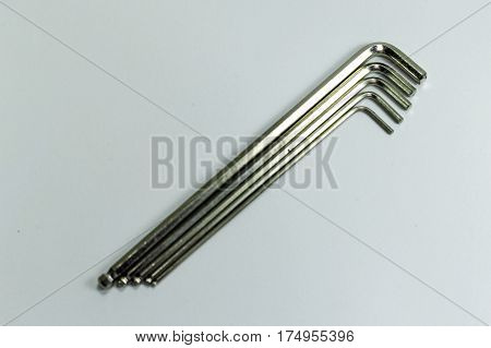 Hex key Set on white background.A hex key, Allen key or Allen wrench is a tool used to drive bolts and screws with hexagonal sockets in their heads.