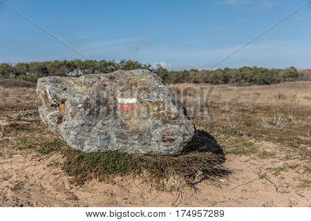 Hiking mark paint `Good direction` on rock in Bretignolles-sur-mer dunes