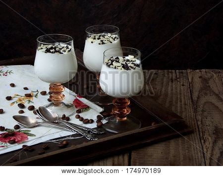 Cheese Puding Dessert In A Glass On Wooden Background