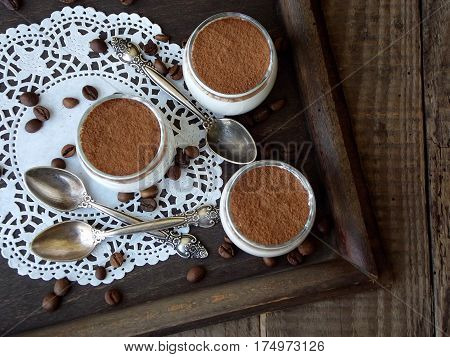 Cheese Puding Dessert In A Glass On Wooden Background