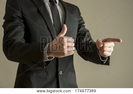 Businessman Giving A Thumbs Up Positive Vote To Show His Approval