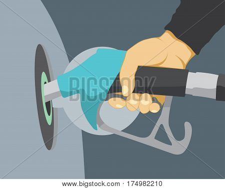 Hand refilling car with fuel nozzle on petrol gas station