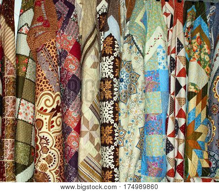 Colorful Eastern scarves on a market stall. Background.