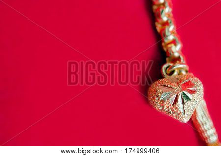 Gold Necklace 96.5 Percent Thai Gold Grade With Gold Heart Pendant Isolated On Red Flannel Cloth Bac