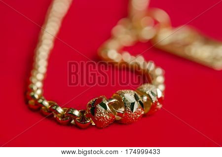 Gold Necklace 96.5 Percent Gold Grade With Italy Design On Red Flannel Cloth Background