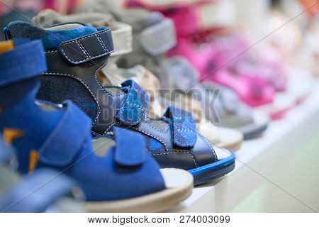 Row of the child shoes in a shop