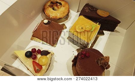 Six Different Desserts In A Box, Yellow And Brown