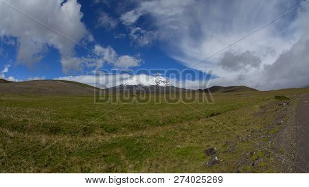 Panoramic View Of Antisana Volcano In A Day With Cloudy Blue Sky. Antisana Is A Stratovolcano Of The