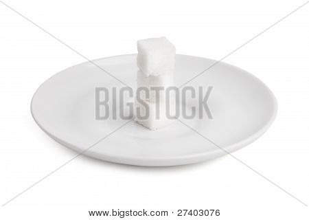 Trzech kostek cukru a biały porcelanowe