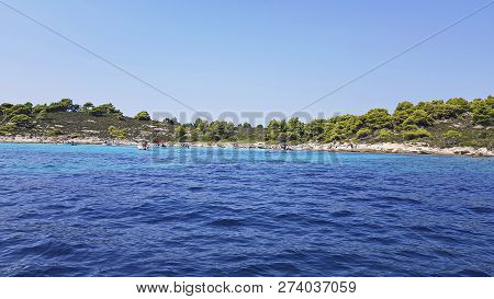 Seascape Sea And Blue Sky.sunny Summer Day. Rocks At The Shore Of  Sea.