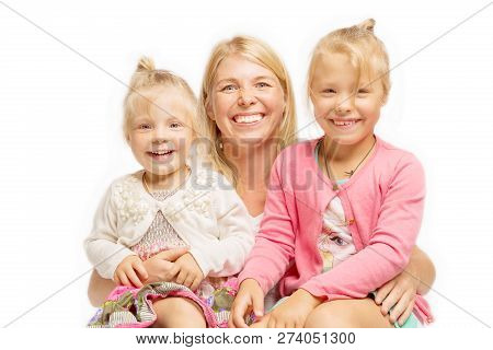 A Young Mother With Daughters Hugs And Laughs, Isolated On White Background