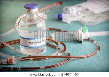 Rubber Drip Irrigation System With Traces Of Blood Along With Vial Of Sodium Thiopental, Conceptual 
