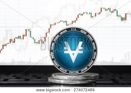 Viacoin (via) Cryptocurrency; Viacoin Coin On The Background Of The Chart