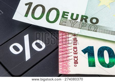 Big Black Calculator And Euro Banknotes Business Background