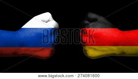 Concept Of Relations/conflict Between Germany And Russia Symbolized By Two Opposed Clenched Fists