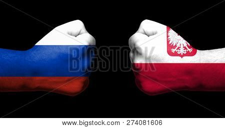 Concept Of Relations/conflict Between Poland And Russia Symbolized By Two Opposed Clenched Fists