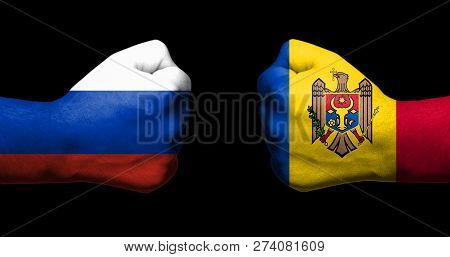 Concept Of Relations/conflict Between Moldova And Russia Symbolized By Two Opposed Clenched Fists