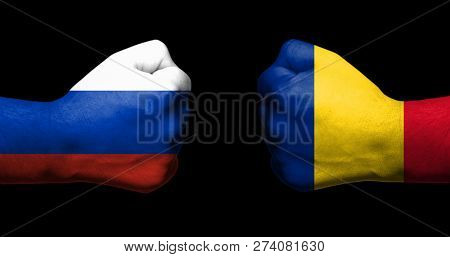 Concept Of Relations/conflict Between Romania And Russia Symbolized By Two Opposed Clenched Fists