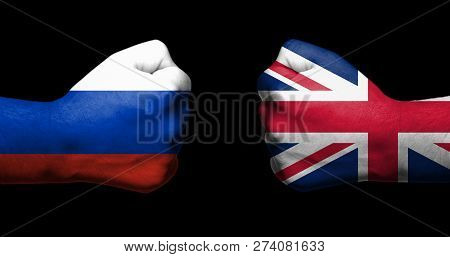 Concept Of Relations Between Russia And The United Kingdom Symbolised By Two Opossed Clenched Fists