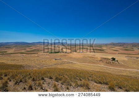 Landscape Of Fields And Horizon With Blue Sky In Castilla La Mancha