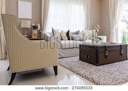 Living Room With Upholstered Furniture, Window Blinds And White Net Curtain