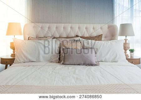 Closeup Of New Bed Comfort With Decorative Pillows Headboard In Bedroom In Staging Model Home