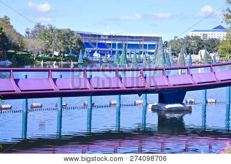 Orlando, Florida. October 19, 2018 Rollercoaster Rail With Christmas Trees And Stadium Background At