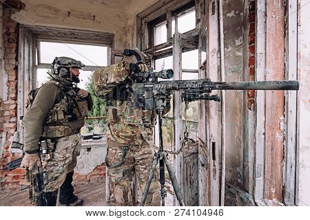 Kyiv, Ukraine - October 14, 2017: Sniper Near The Big Sniper Rifle In The Old Building During Airsof