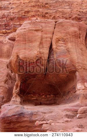 Ancient Tombs Inside The Red Rocks Of Bright Mountains Of City Petra, Jordan, Outdoor, Sunny Day. Un