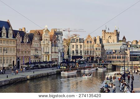 Ghent, East Flanders, Belgium, October 17, 2018: View Of Water Canal With Boats, Bridge And Medieval