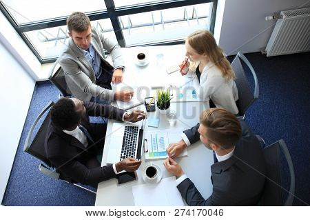 Top View Of Business People Working Together While Spending Time In The Office.