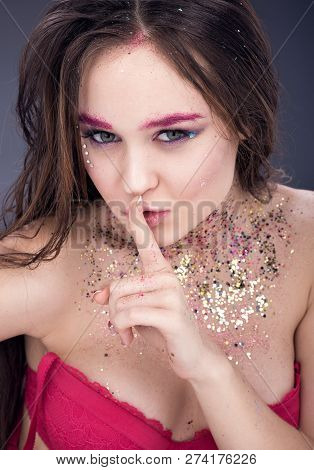 Portrait Of Sexy Young Woman In Red Lingerie. Wet Your Hair And Makeup With Multicolored Sequins. Ne