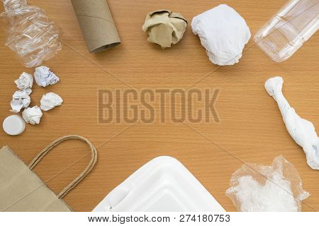Top View Of Recycling Garbage Waste On Wooden Background With Center Copy Space , Eco And Save World