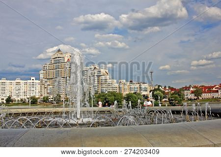 Minsk, Belarus - August 13, 2018:  Fountain And High Rise Apartment House On Svislach River Embankme