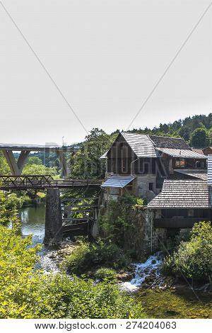 Karona River Canyon And Waterfalls Next To An Old Mill House At Rastoke In The Town Of Slunj