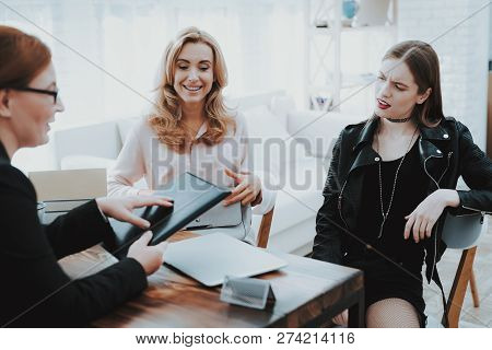 Upset Teenage Daughter In Jacket In Psychologist Office With Mother. Punk In Lather Jacket. Communic