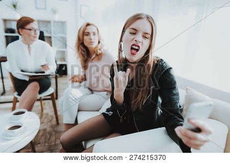 Teenage Girl In Leather Jacket With Upset Mother Taking Selfie In Psychologist Office. Punk In Lathe