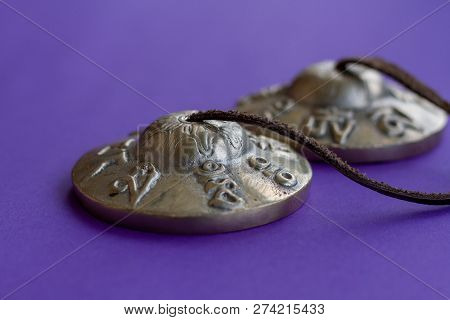 Tibetan Tingsha: A Musical Instrument With Eight Sacred Symbols Of Wealth And Well-being On The Body