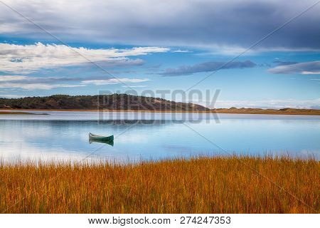 Canoe During Calm Day In A Cape Cod Sound