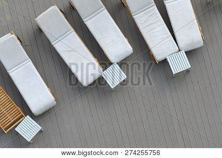 Wooden Plank Beds For Suntan At Hotel Standing On A Wooden Floor.top View