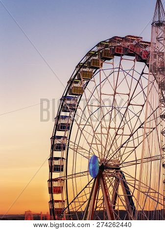 View Of Rounded Colorful  Ferris Whell At Sunset  In Madrid.spain