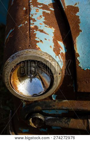 Old, Rusty Car Wreck Front And Lamp Detail