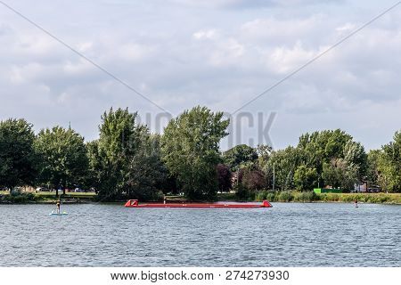 Lasalle, Quebec - August 15, 2018 - Horizontal Landscape Of People On Paddle Boards Enjoying The Lak