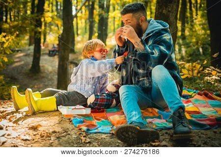 Cute Little Boy With His Father During Stroll In The Forest.