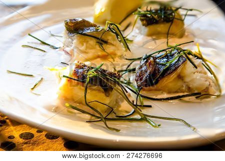 Pieces Of Fried Fish Catfish Lie On A Plate.