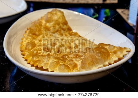 Traditional Tatar Dish, Chebureki. Puff Pastry Pie With Meat Filling.